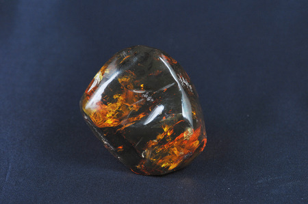 Picture of an Amber stone on dark backgroundの写真素材