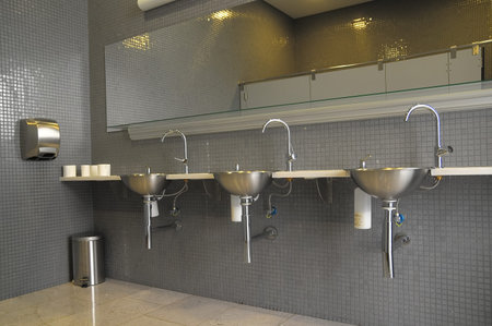 An Interior of a Private Restroom with Mirror