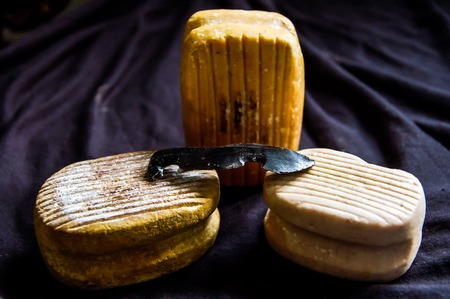 Hand Made Old Rock Mayan Instruments on a Dark Backgroundの写真素材