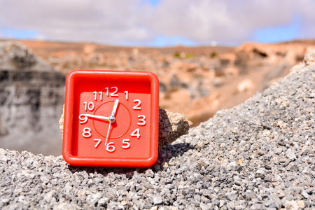 Conceptual Photo Picture of an Alarm Clock Object in the Dry Desertの写真素材
