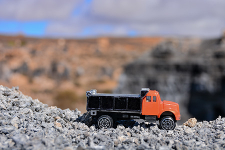 Conceptual Photo Picture of a toy car in the dry desertの写真素材