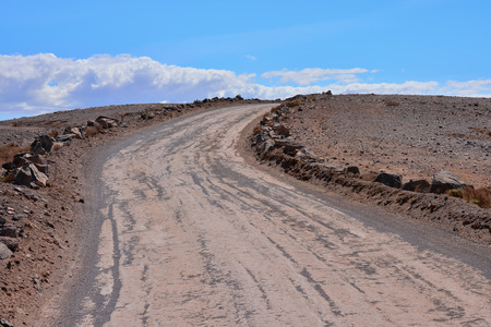 Photo Picture of a Dirt road leading off into the desertの写真素材