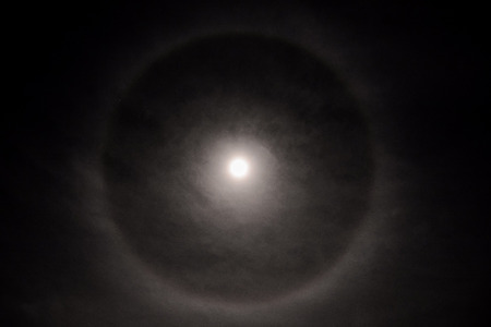 Photo Picture Full moon in a cloudy sky with haloの写真素材