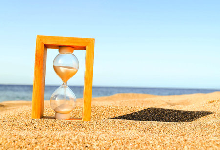 Photo Picture of Hourglass Clock on the Sand Beach