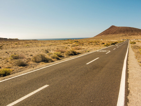 Long Empty Desert Asphalt Road in Canary Islands Spainの写真素材