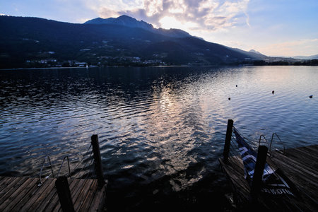 Photo Lake Lago di Caldonazzo on the Background of Dolomites in Italyの写真素材