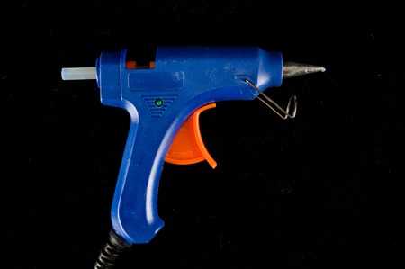 Classic vintage Electric hot glue gun pistol isolatedの写真素材