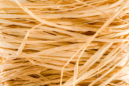 Closeup of golden round hay texture backgroundの写真素材