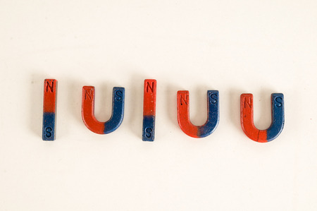 Close-up of red and blue magnet Object on a White Backgroundの写真素材