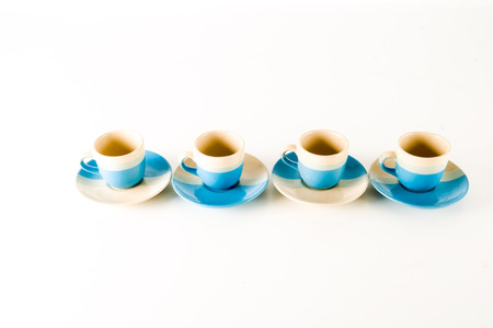 Small modern espresso cups on a white backgroundの写真素材