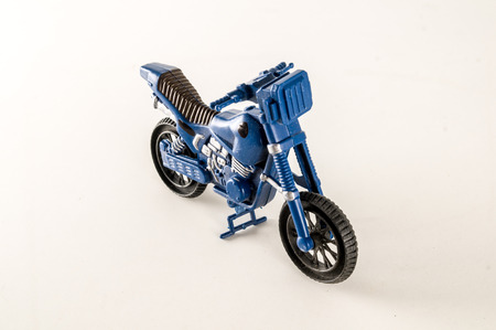 Close-up of toy motorbike motorcycle Object on a White Backgroundの写真素材
