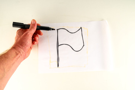 Close-up of sheet with drawing flag Object on a White Backgroundの写真素材