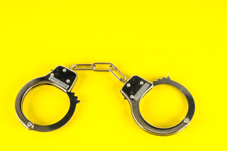 Close-up of handcuffs Object on a White Backgroundの写真素材