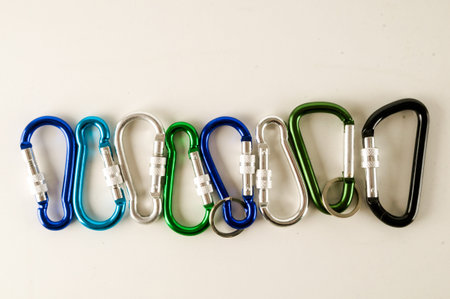 Metal aluminum snap hook isolated background Safety lock carabiner for rope climbing