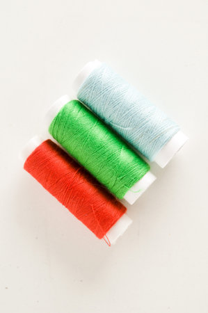 Photo Picture of Colored sewing thread wire background