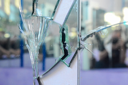 Photo of Broken mirror shattered in many pieces
