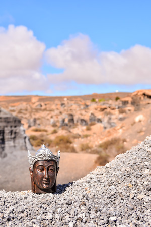 Conceptual Photo Picture of an Buddha in the dry desertの写真素材