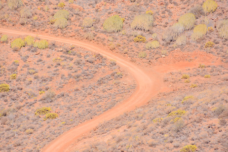 Photo Picture of a Dirt road leading off into the desertの写真素材