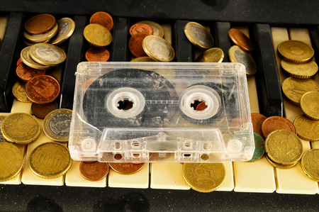 Photo picture close-up of piano keys keyboard and musicassette tapeの写真素材