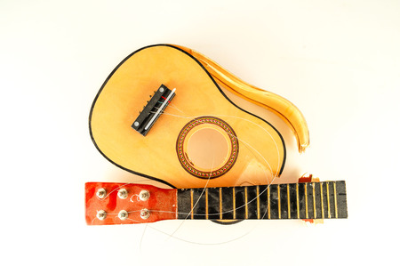 Close-up of borken classic guitar Object on a White Backgroundの写真素材