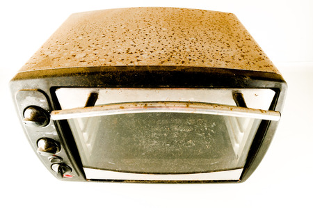 small old electric oven isolated in the kitchenの写真素材