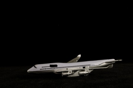 Close-up of toy airplane Object on a black Backgroundの写真素材