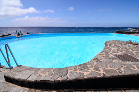 Lovely blue round pool in the garden in the park.の写真素材