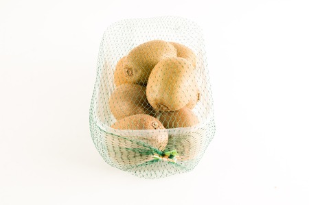 Kiwi in a box isolated on white backgroundの写真素材