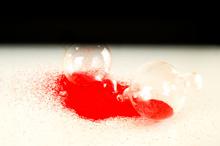 Close-up of broken hourglass Object on a White Backgroundの写真素材