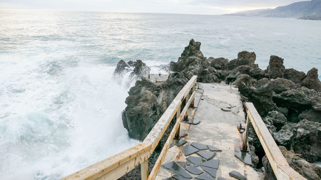 Rough Sea with Large Waves Breaking on the Coastの写真素材