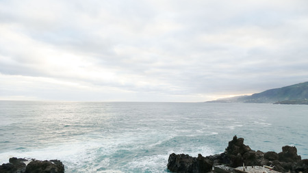 Rough Sea with Large Waves Breaking on the Coastの写真素材
