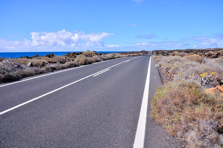 Long Empty Desert Asphalt Road in Canary Islands Spainの写真素材