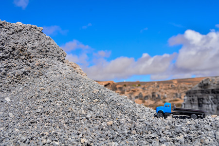 Conceptual Photo Picture of a toy car in the dry desertの写真素材
