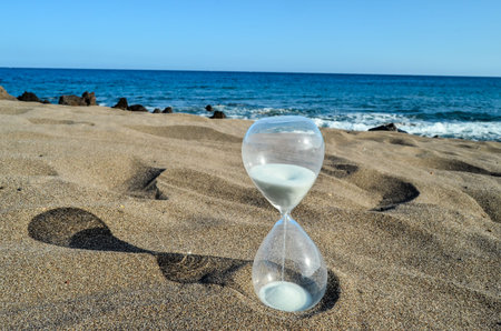 Photo Picture of Hourglass Clock on the Sand Beach