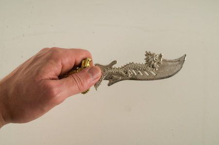 Close-up of oriental knife sword toy Object on a White Background