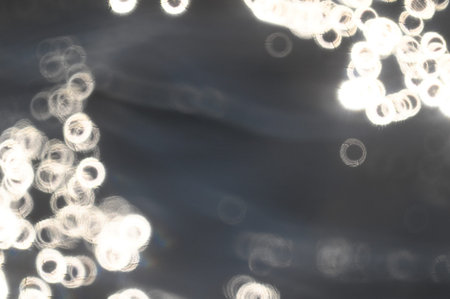 Textured White Backlight Circles on a Blue Backgroundの写真素材