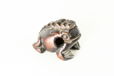 Typical vintage Oriental wooden frog musical instrument souvenirの写真素材