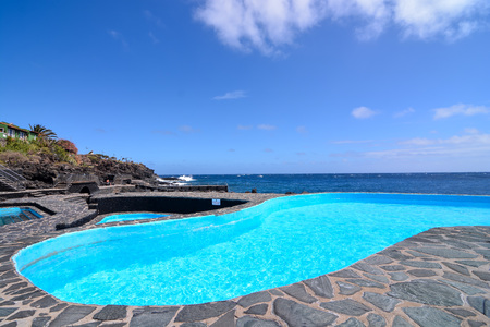 Lovely blue round pool in the garden in the park.の写真素材