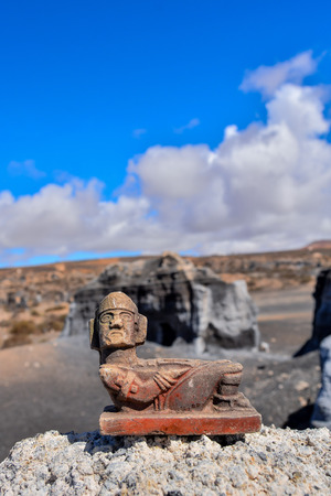 Conceptual Photo Picture of a Mayan Statue in the dry desertの写真素材