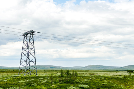 electricity pylon in field, beautiful photo digital pictureの写真素材