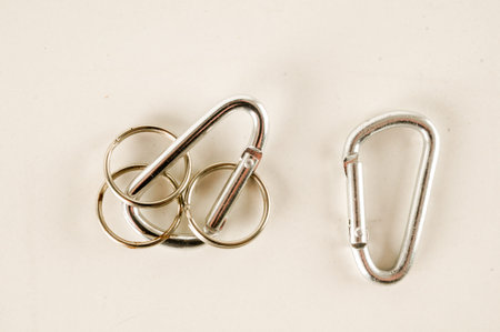 Metal aluminum snap hook isolated background Safety lock carabiner for rope climbing