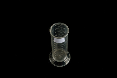 Close-up of measuring glass Object on a Black Backgroundの写真素材