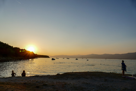silhouette of man on beach at sunset, beautiful photo digital pictureの写真素材