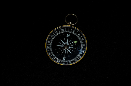 Vintage Classic Compass on a Black Backgroundの写真素材
