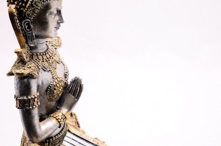 Oriental Asian Statue on a White Backgroundの写真素材