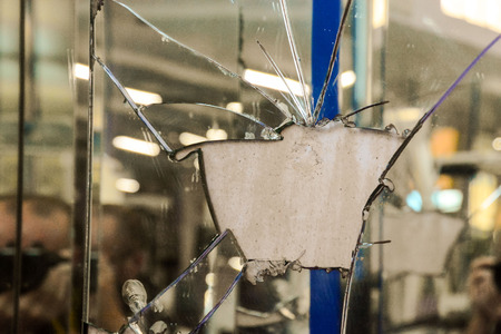 Photo of Broken mirror shattered in many piecesの写真素材