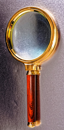 Vintage Magnify Glass Loupe on a Colored Backgroundの写真素材