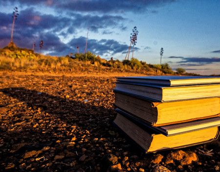 On the Road Learnig Concept Books over the Desertの写真素材