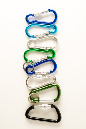 Metal aluminum snap hook isolated background Safety lock carabiner for rope climbingの写真素材