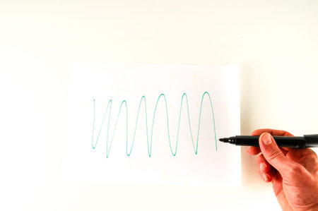 Close-up of sheet with drawing Object on a White Backgroundの写真素材